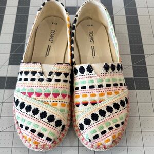 TOMS White Canvas Slip-Ons with Multicolor Embroidered Accents